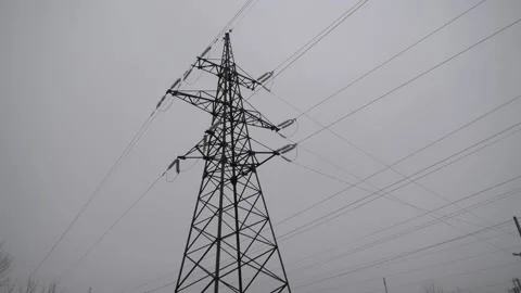 High-voltage transmission lines with electrical wires against a cloudy sky Stock-Footage 229406334