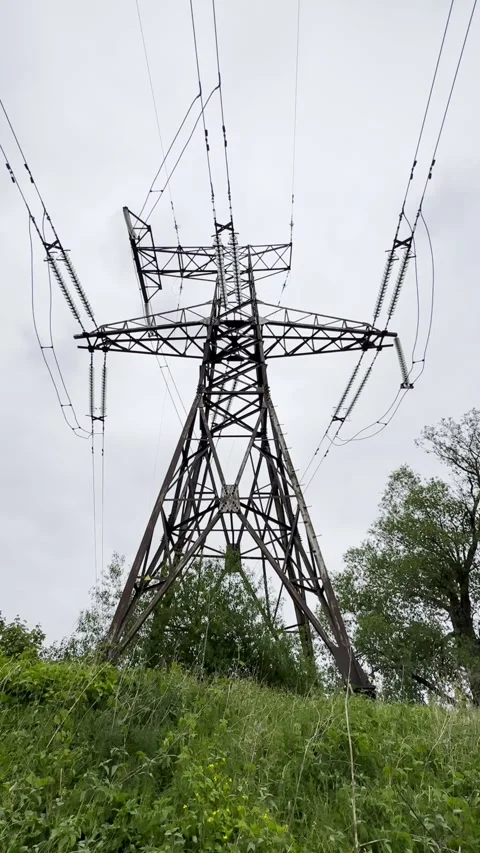 High Voltage Transmission Tower and Overhead Power Lines Stock Footage 341569199