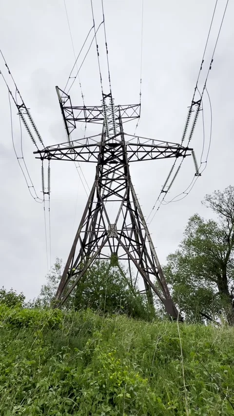 High Voltage Transmission Tower and Overhead Power Lines Stock Footage 341569229