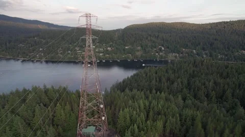 High voltage transmission tower, electric grid, structure, mountain top, ocean Stock Footage 247644161