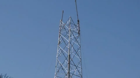 High Voltage Transmission Tower – Power Lines and Electricity Infrastructure Stock Footage 333451643