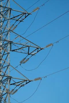High voltage transmission tower section with suspended insulators and angle.. Stock Photos