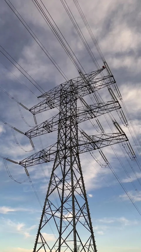 High Voltage Transmission Tower Supporting Renewable Energy Grid Modernization Stock Footage 329894899