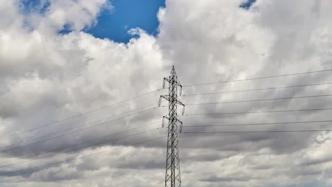High voltage utility pole and clouds in time lapse clip Stock Footage 131312276