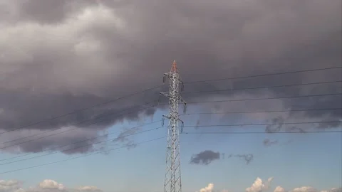 High voltage utility pole and clouds in time lapse clip Stock Footage 131312797