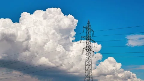 High voltage utility pole and clouds in time lapse clip Stock Footage 131434048