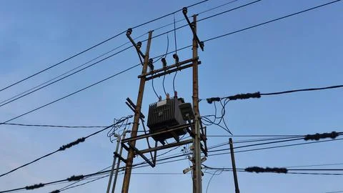 High Voltage utility pole with transformer Fotos de archivo