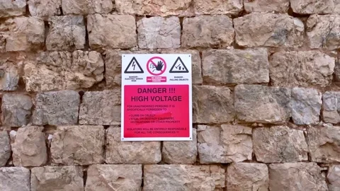 High Voltage warning sign in different languages  Stock Footage 142737002