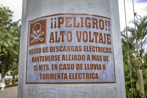 High voltage warning sign displaying skull and crossbones in valladolid, mexi Stock Photos