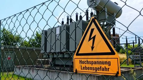High Voltage Warning Sign at Electrical Substation Transformer Stock Photos
