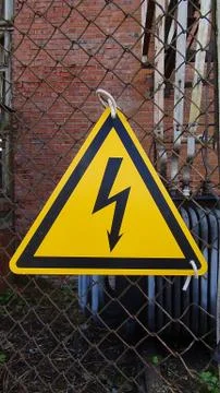 High voltage warning sign on high voltage substation Stock Photos