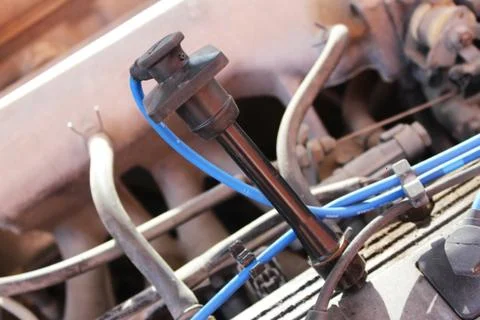 High-voltage wire in an automobile engine Stock Photos