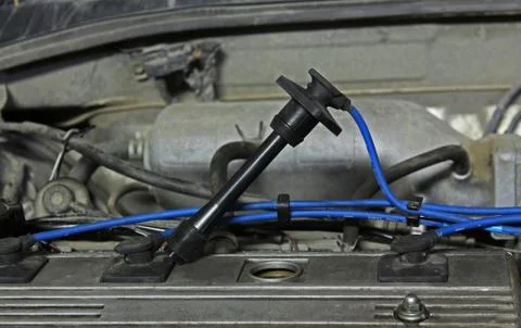 High-voltage wire in an automobile engine Stock Photos