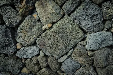 The high wall made by gray stone. 스톡 사진