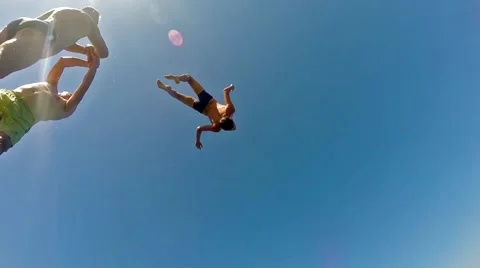 High water jumping from springboard backflip and diving, slow motion Stock Footage