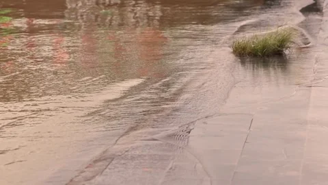 High water levels after the typhoon water overflow onto the embankments Stock Footage 290059921