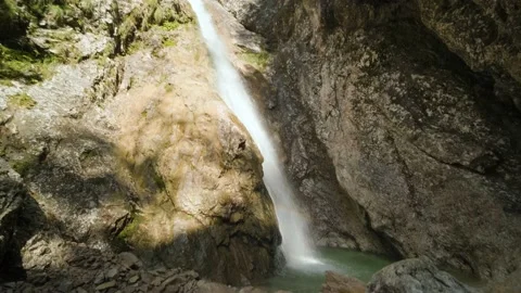 High Waterfall That Flows Into Small Natural Pool With Small Rainbow. Stock Footage 168497765