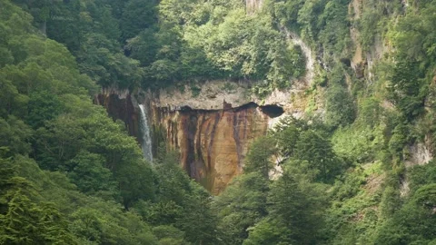 High waterfall in the forest of Japan. Long-distance shooting Video stock 136038243