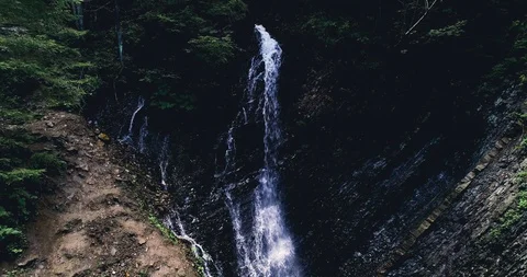 High waterfall in a green forest 4k view Stock Footage 128698485