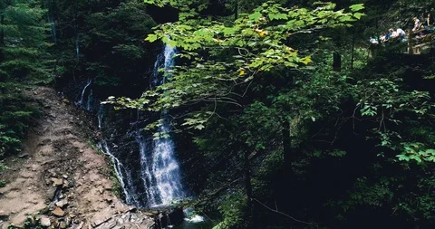 High waterfall in a green forest 4k view Stock Footage 128698511