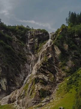High waterfall in mountain area Stock Photos