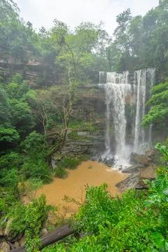 High waterfall with rock layer in the deep forest 스톡 사진