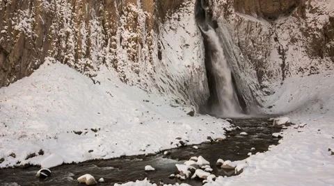 High waterfall in the tract Gil-Su high in the Caucasus mountains in winter Video stock 68908121