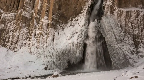High waterfall in the tract Gil-Su high in the Caucasus mountains in winter Stock Footage 68908217