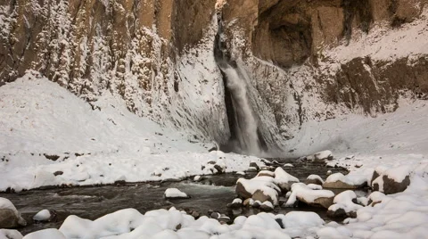 High waterfall in the tract Gil-Su high in the Caucasus mountains in winter Video stock 68908533