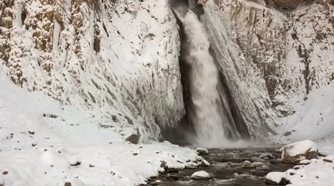 High waterfall in the tract Gil-Su high in the Caucasus mountains in winter Video stock 68909111