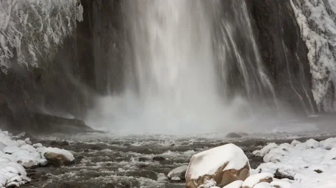 High waterfall in the tract Gil-Su high in the Caucasus mountains in winter Video stock 68909645