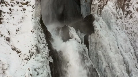 High waterfall in the tract Gil-Su high in the Caucasus mountains in winter Video stock 68909762