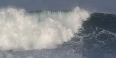 A high wave swelling and breaking in frame-filling foam Stock Footage 59526776