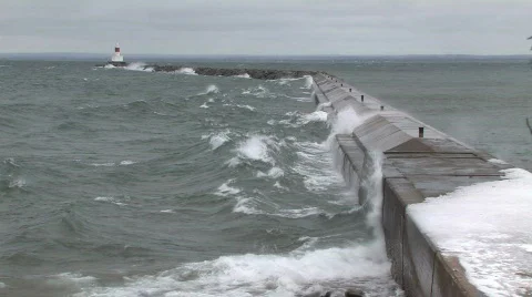 High waves against break wall with light beacon HD Stock Footage 303200