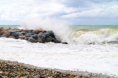 High waves beat against the rocks on the Black Sea Stock Photos