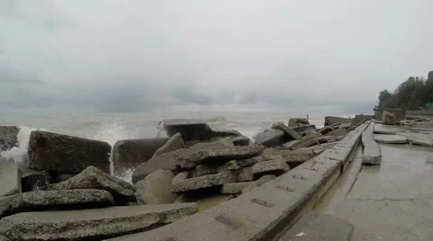 High waves crashing against the rocks. Black sea. The gray sky. Splashing waves 動画素材 48933565