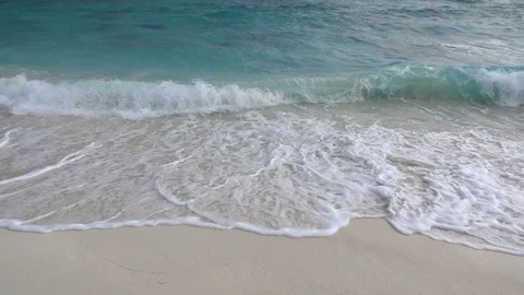 High waves crashing on sandy beach. Storm on the sea. Slow motion 240 fps Video stock 119150391