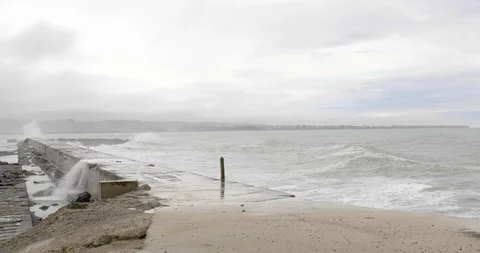 High waves splashing on the jetty Stock Footage 93609376