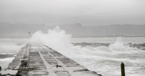 High waves splashing on the jetty Stock Footage 93609650
