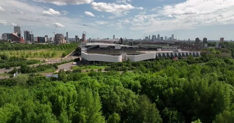 High way road passes through green park along residential houses Video stock 201469892