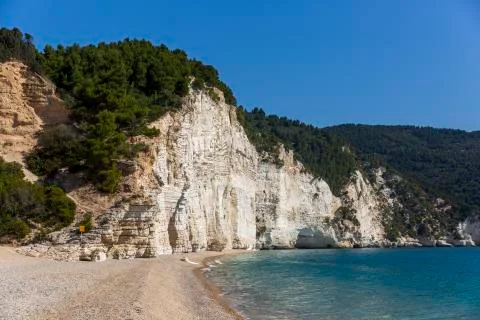 High white cliffs of Vignanotica beach in Apulia region, Italy Stock Photos