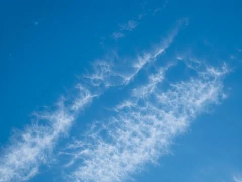 High white clouds in bright blue sky Stock Photos