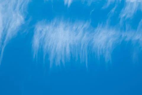 High white clouds in bright blue sky Stock Photos