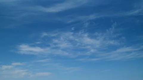 High white wispy cirrus clouds. Northern sky in polar area. Looks like a feather Stock Photos