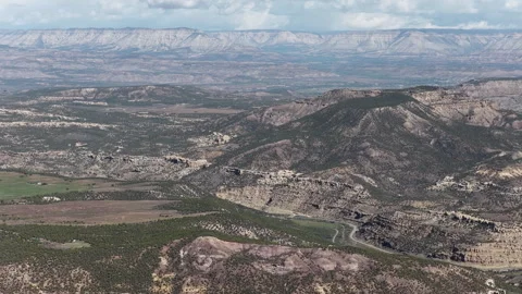High wide aerial of De Beque Canyon in Mesa Colorado desert Book Cliffs Stock-Footage 334345100