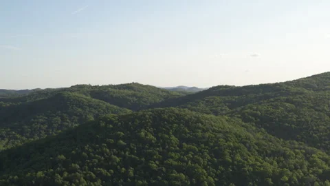 High wide aerial slow push in on Appalachian mountains in North Carolina Stock Footage 240974418