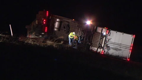 High winds blow over semi trailer truck - Extreme weather Stock Footage 236333901