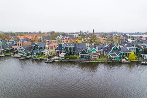 Highangle panorama with a row of old dutch green traditional houses in the town Stock Photos