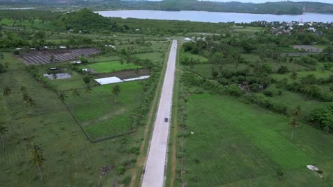 Highangle Shot Capturing Vehicle Movement On Vibrant Coast Road Stock Footage 328217017