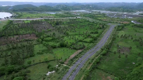Highangle Shot Capturing Vehicle Movement On Vibrant Coast Road Stock Footage 328217221